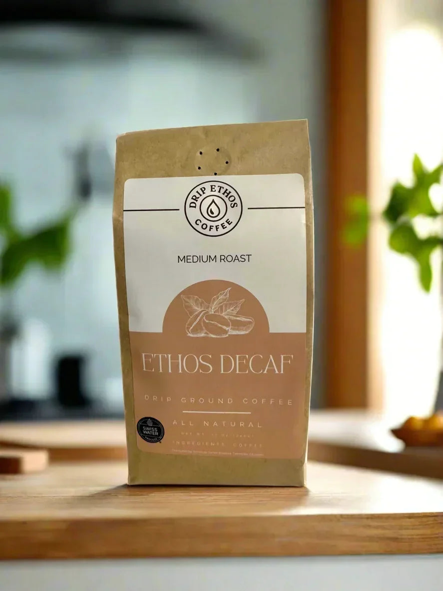 Ethos Decaf medium roast drip ground coffee bag on kitchen counter, all natural branding